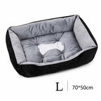 Orthopädisches Plüsch-Hundebett in Schwarz-Grau, Größe L (70x50 cm) – mit gesteppter Liegefläche und Knochen-Motiv | Hund & Heim
