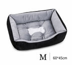 Orthopädisches Plüsch-Hundebett in Schwarz-Grau, Größe M (60x45 cm) – mit gesteppter Liegefläche und Knochen-Motiv | Hund & Heim
